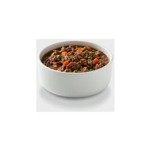 Slow-cooked turkey stew topper for dogs with carrot and peas
